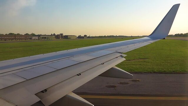 wing of an airplane that takes off from an airfield.