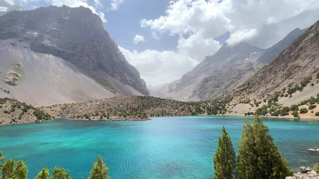 The Alaudin (Chapdara) lakes, lying at an altitude of 2800 m, are considered one of the most beautiful lakes of the Fan Mountains. Turquoise mountain lake. Pamiro-Alai. Tajikistan, Pamir 4K