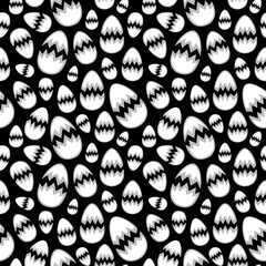 Cracked eggshells in different sizes arranged randomly on a black background. Simple monochrome seamless pattern for printing on different materials or use in graphic design projects.