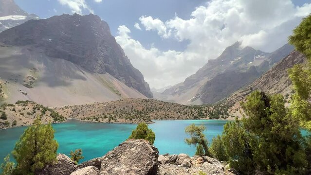 The Alaudin (Chapdara) lakes, lying at an altitude of 2800 m, are considered one of the most beautiful lakes of the Fan Mountains. Turquoise mountain lake. Pamiro-Alai. Tajikistan, Pamir 4K