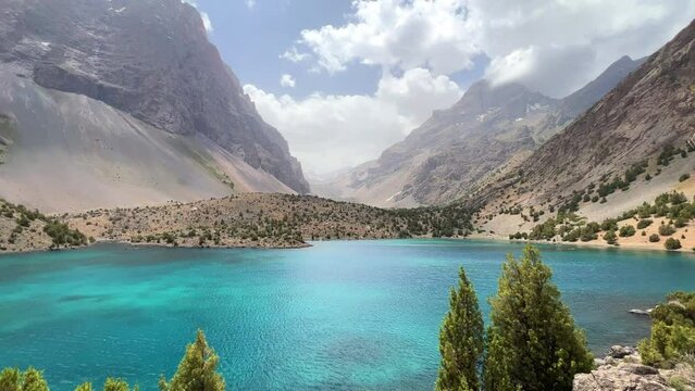 The Alaudin (Chapdara) lakes, lying at an altitude of 2800 m, are considered one of the most beautiful lakes of the Fan Mountains. Turquoise mountain lake. Pamiro-Alai. Tajikistan, Pamir 4K