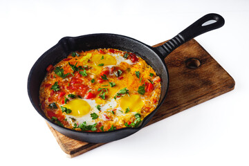 pan of delicious traditional israeli shakshuka on a white background