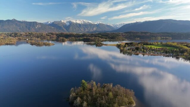 Aerial view, Staffelsee with islands, Garmisch Partenkirchen region, Bavaria, Germany near Murnau in sunny weather at sunset in spring. Drone view over islands of a large beautiful lake in Bayern. 
