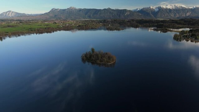 Aerial view, Staffelsee with islands, Garmisch Partenkirchen region, Bavaria, Germany near Murnau in sunny weather at sunset in spring. Drone view over islands of a large beautiful lake in Bayern. 