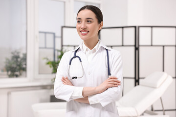 Medical consultant with glasses and stethoscope in clinic