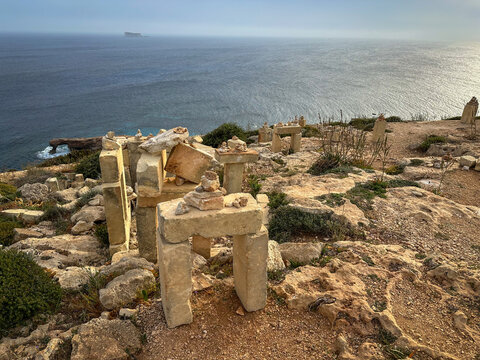 a wonderful view with a wonderful atmosphere at sunset on the island of Malta, Qrendi, near the sea, A tourist trip on Malta to a beautiful place in nature, the Blue Grotto cliff and Hagar quim temple