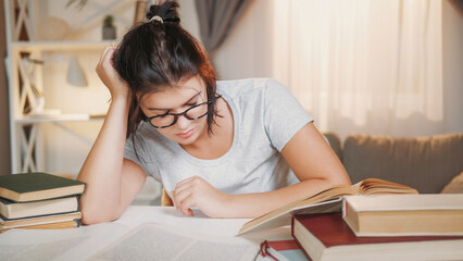 Hard education. Overworked student. Deadline stress. Tired sleepy woman reading book preparing homework light room interior. - 787206548