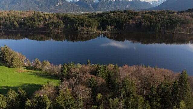 Aerial view, Staffelsee with islands, Garmisch Partenkirchen region, Bavaria, Germany near Murnau in sunny weather at sunset in spring. Drone view over islands of a large beautiful lake in Bayern. 