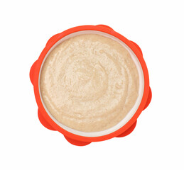 Tasty baby food in bowl isolated on white, top view