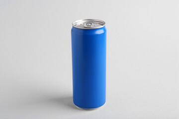 Energy drink in blue can on light grey background