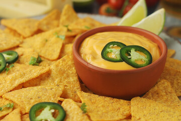 Corn tortilla chips with cheese sauce