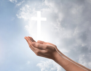 Religion. Christian woman praying against sky with glowing cross, closeup