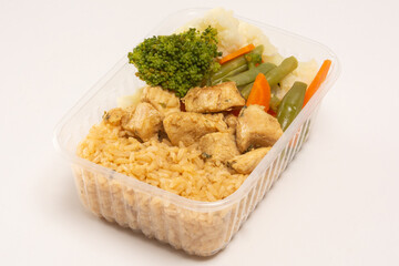 Healthy vegetables and grilled chicken packed lunch box meal in front top aerial view clean white background