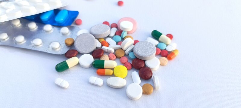 pills and capsules on white background creative stock closeup photo