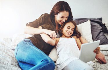 Smile, mother and kid on tablet in bed at home together for game, bonding and family streaming...