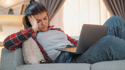 Sleepy woman. Internet addiction. Work fatigue. Overworked female freelancer sleeping with laptop...
