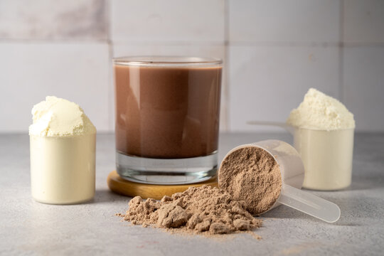 Protein powder and protein drinks, with scoops. Food supplement, bodybuilding, fitness and sport
