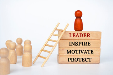 Leader that inspire, motivate and protect text on wooden blocks. Leadership concept