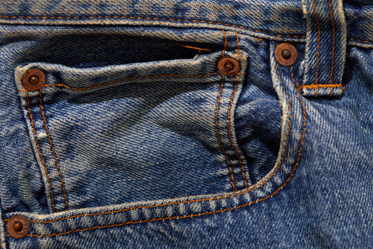 Close-up of pocket on worn jeans