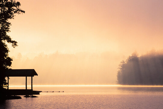 Morning mist above Lake Placid at sunrise in Adirondack Mountains