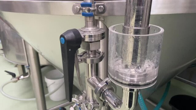 Manometer equipment for pressure control at microbrewery. Gauges pressure control device: manometer at craft brewery. Water gurgles and water bubbles.
