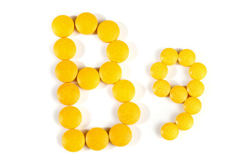 Vitamin B Pills isolated - B9 on white background