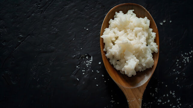 Uncooked rice with a wooden spoon Raw surti kolam rice over black background copy space : Generative AI