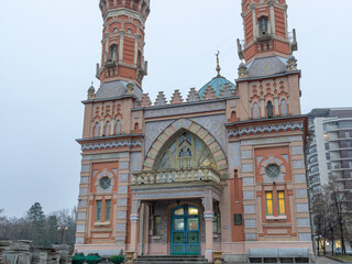 An ancient Muslim mosque with domes on the background of mountains. The mosque was built at the...