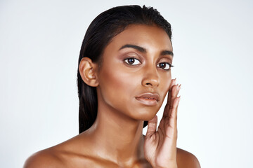 Studio, beauty and portrait of Indian woman with skincare from dermatology in mockup space. Face,...