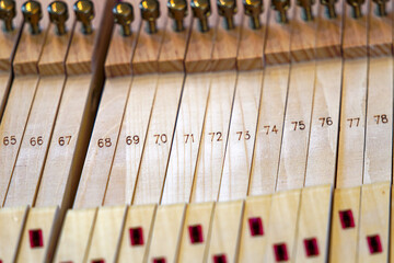 Close-up of removed wooden keys of piano lying on table in living room at Swiss City of Zürich. Photo taken April 17th, 2024, Zurich, Switzerland.