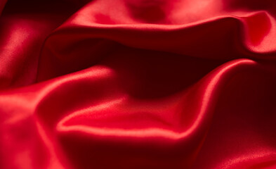 The bright red silk satin surface is beautiful and luxurious, wavy. For background and graphic work Blurry or blurry