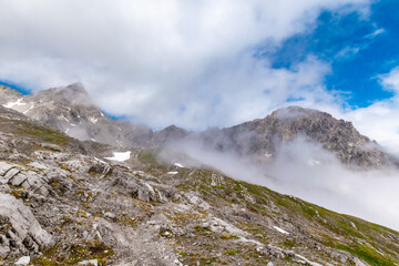 View of a Rocky Massif in the Austrian Alps Shrouded in Clouds