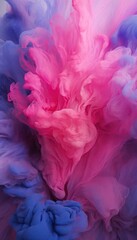 Abstract art of swirling pink and blue ink clouds in water, conveying a dreamy and creative atmosphere.

