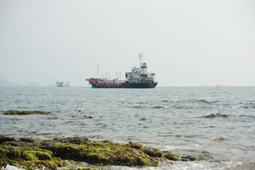 Island with big ship in the background