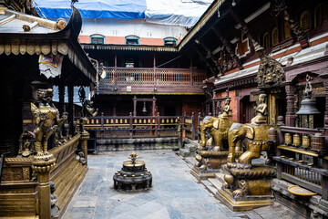 views of Hiranya Varna Mahavihar temple in kathmandu - obrazy, fototapety, plakaty