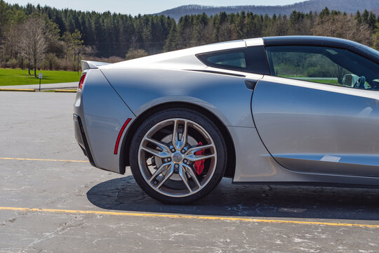 corvette copy space background super car on a parking lot, natural light authentic real life car