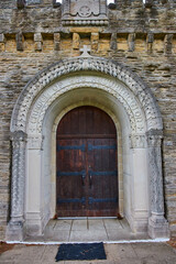 Fototapeta na wymiar Historic Chapel Doorway with Stone Arch and Cross Design, Indiana