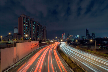 Car lights on the Hangang River Expressway Bridge are the best landmarks and traffic in Seoul, South Korea.