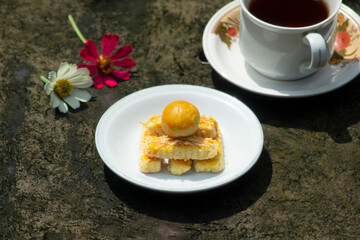 backed cake and tea with flowers