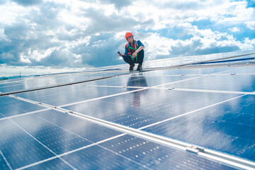 Male professional engineer installing solar photovoltaic panel system, Electrician mounting blue...