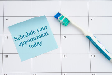 Dental appointment with toothbrush and sticky note on a calendar - 787311316