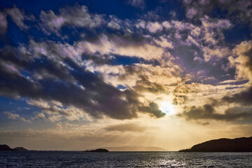 Fototapeta premium West from Craobh Haven, The sun starts to sink low as dusk begins to take shape. Craobh Haven, Argyll and Bute, Scotland