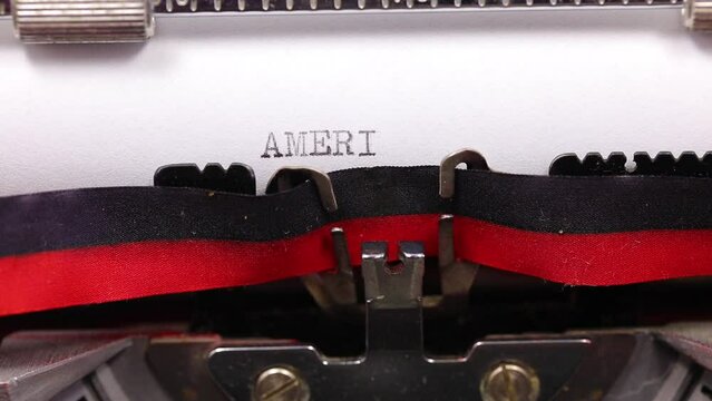 text AMERICA with a vintage typewriter with black ink
