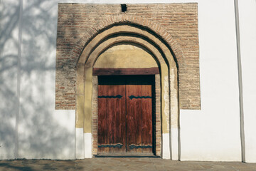 Wooden door to the church. St.Cyril church exterior. Ancient doorway to cathedral. Ukrainian historical church. Vintage wooden entrance to the dome. Religious architecture. Old arch gate to cathedral. - 787334165