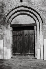 Wooden door to the church, Kyiv, Ukraine. St.Cyril church exterior, monochrome. Ancient doorway to cathedral. Ukrainian historical church. Vintage wooden entrance to the dome. Religious architecture.  - 787334186