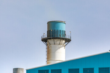 Closeup view of one of the exhaust stacks at a gas powered electricity generating station