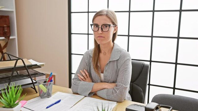 Nervous young businesswoman frowning in skeptic doubt at office, grapples with unhappy emotion over negative office problem