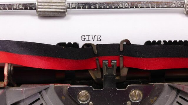 large text GIVE PEACE A CHANGE written with a vintage typewriter with black ink