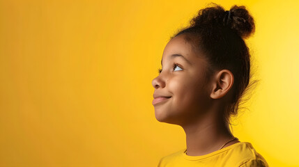 Pensive smiling African American girl isolated on yellow studio background look at copy space aside Happy biracial teen child consider good sale deal or promotion offer Advertising con : Generative AI - Powered by Adobe