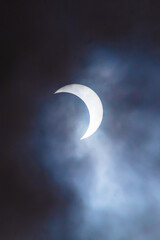 Obraz na płótnie Canvas Annular eclipse behind dark clouds